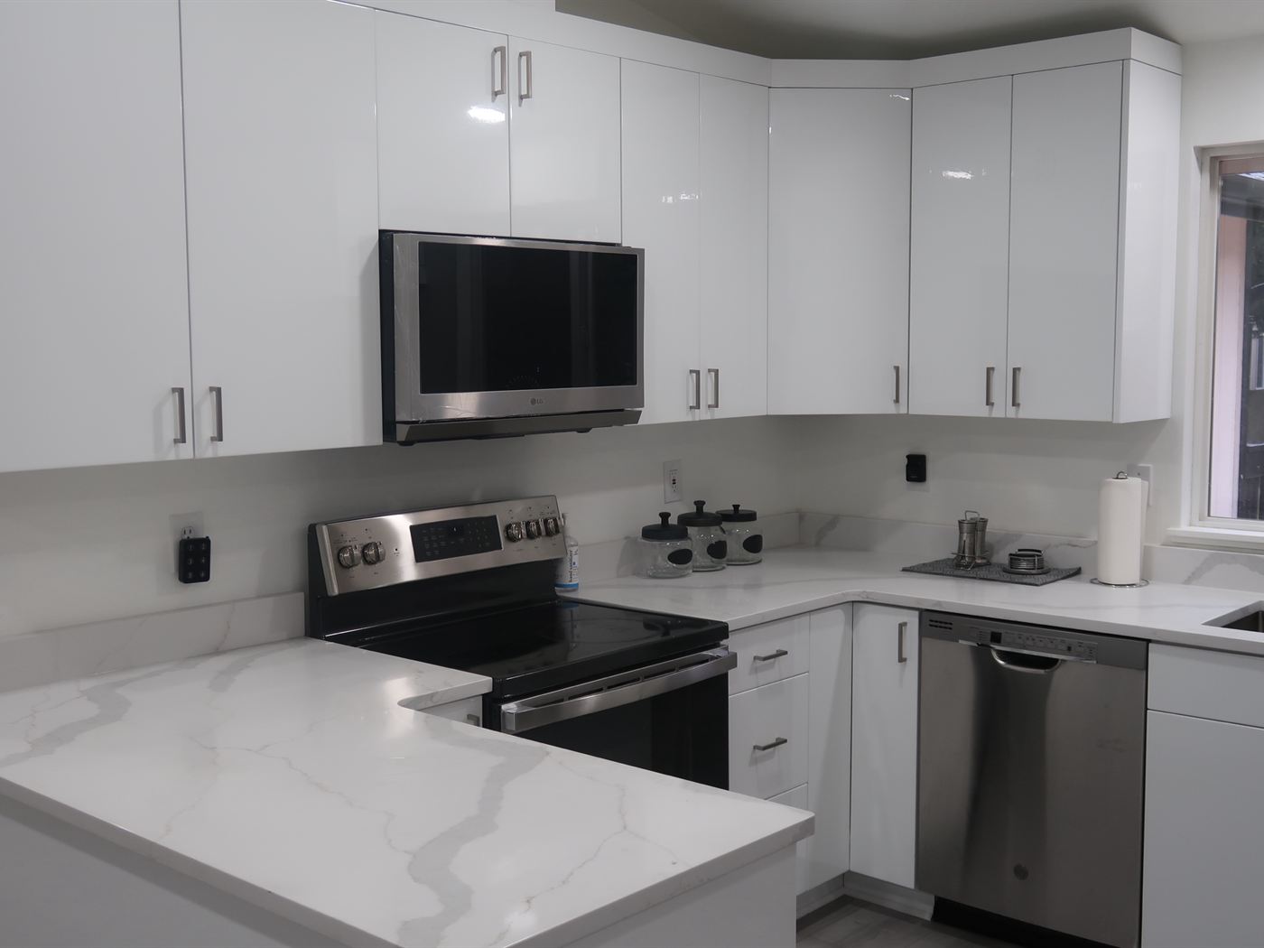 The kitchen, with daylight from the window over the sink
