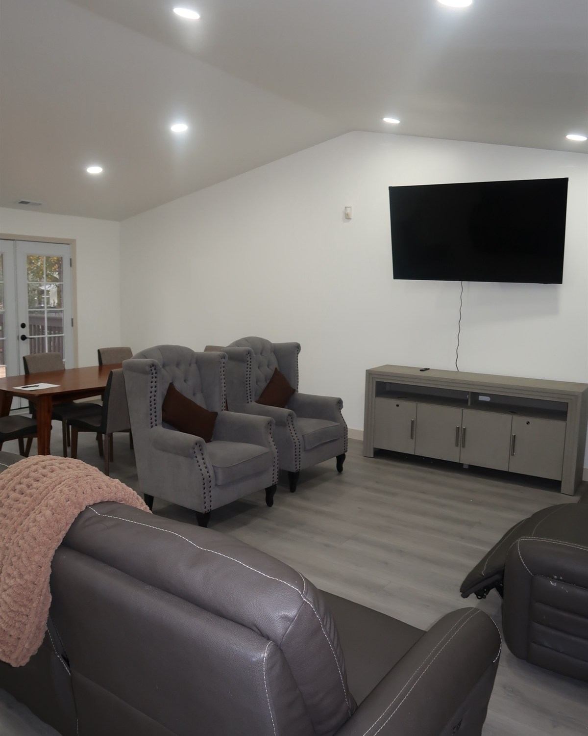 The shared living room with armchairs and seating